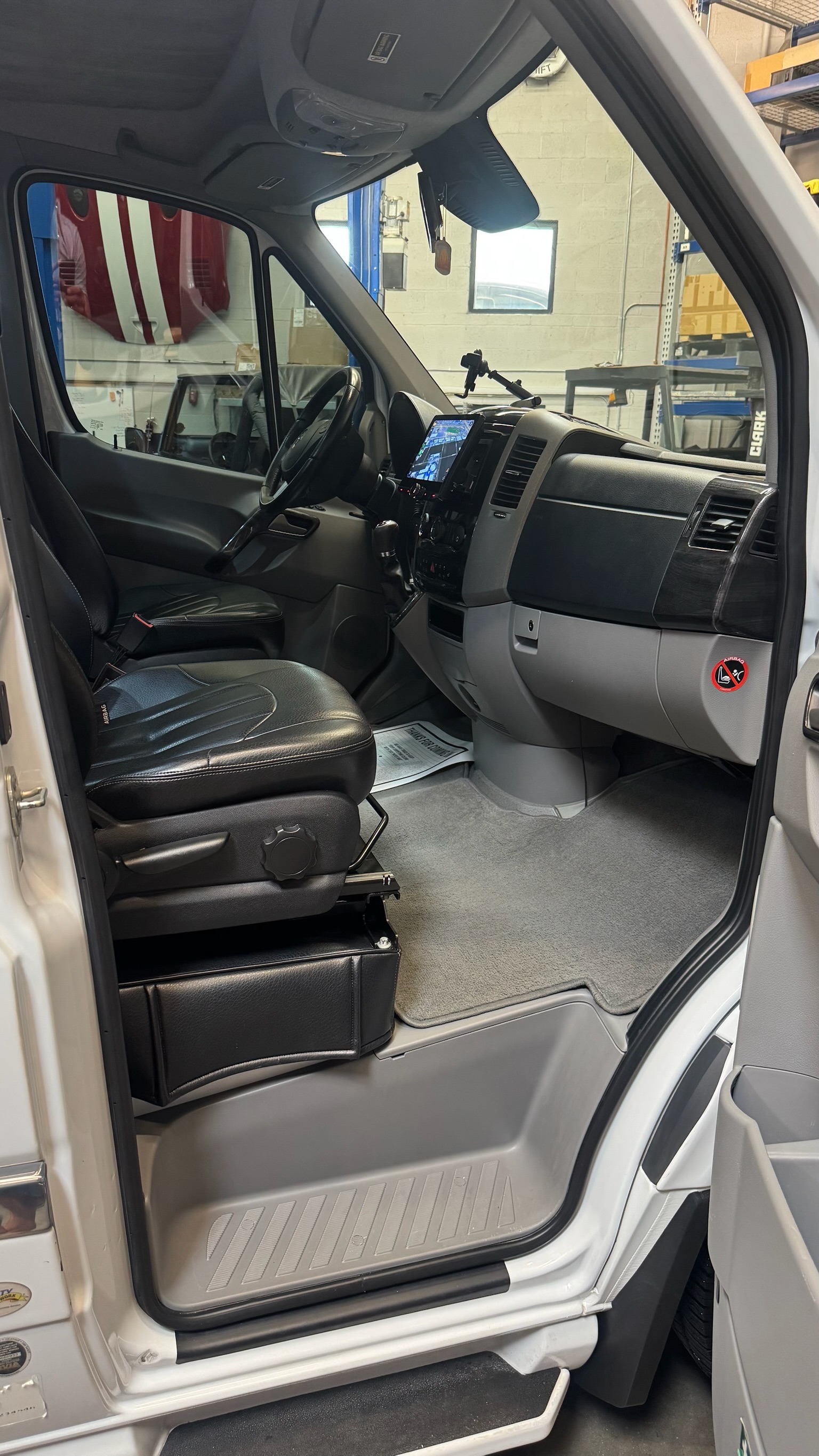 Captain's chairs — black leather with white stitching