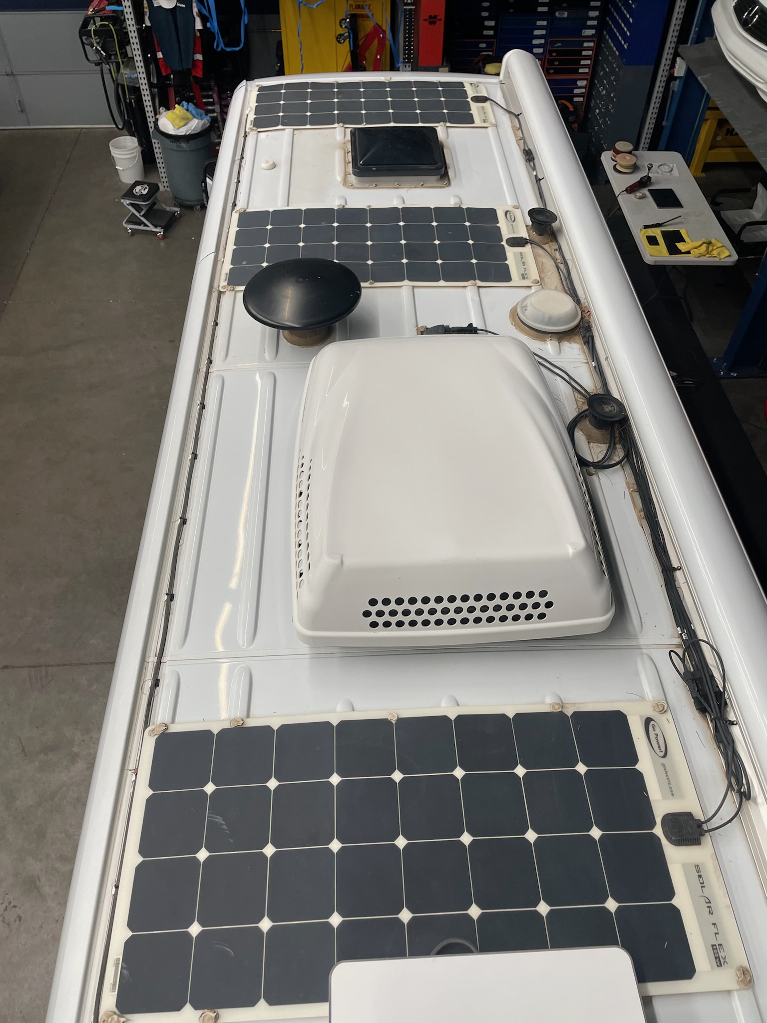 Rooftop — solar panels, Starlink dish, AC unit